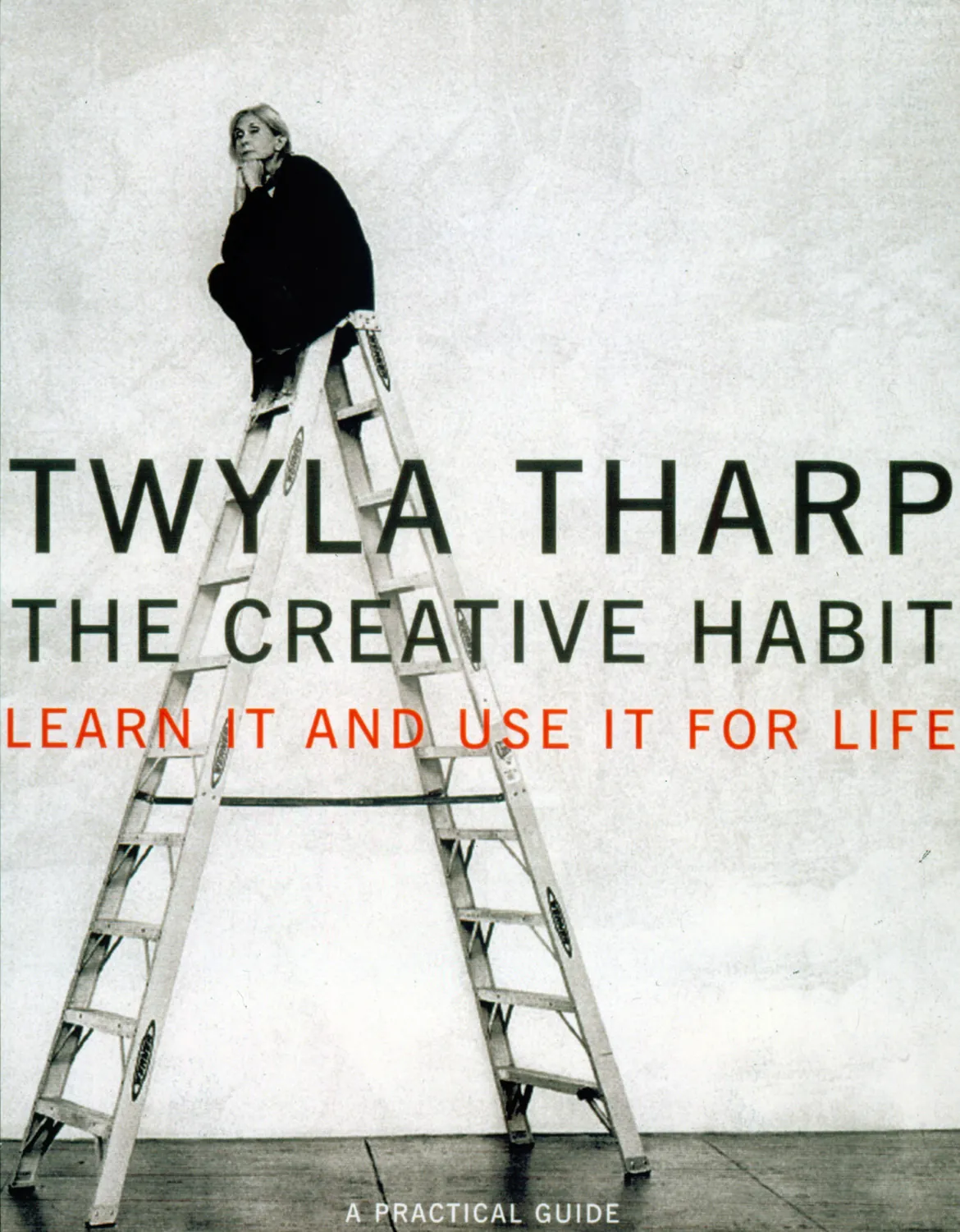 The cover of The Creative Habit, with Twyla Tharp sitting at the top of a ladder